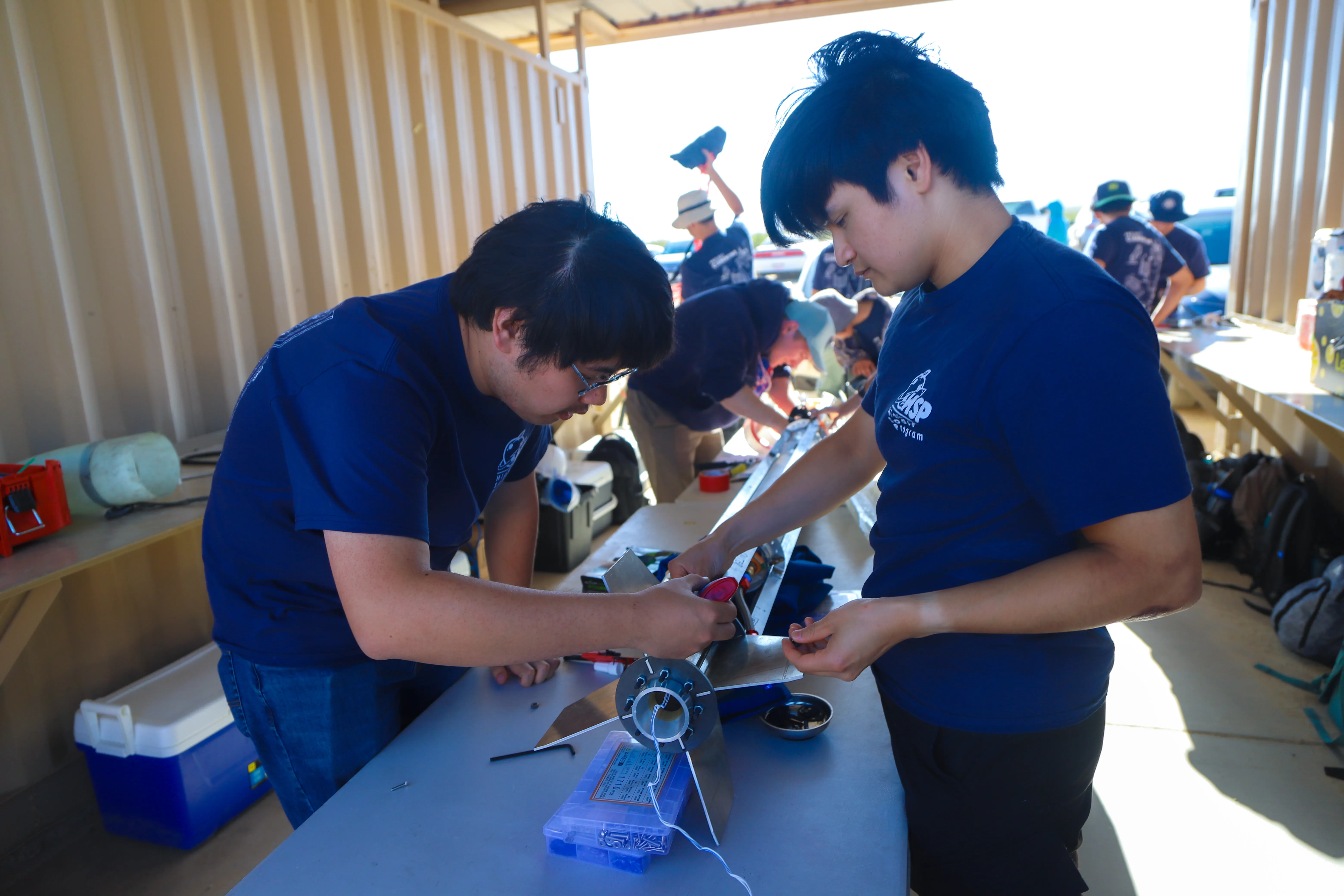 Students assembling rocket structures