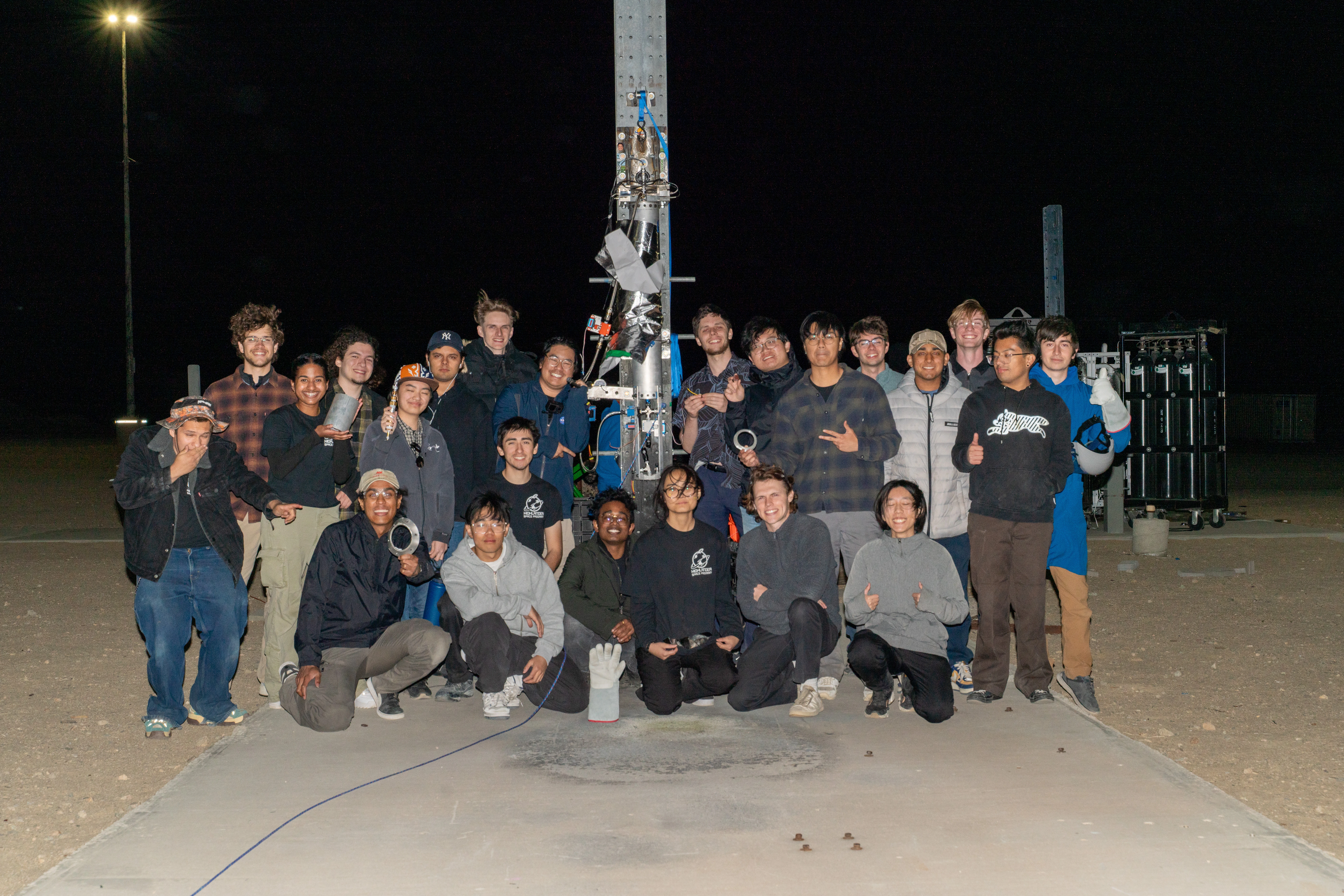 The team gathered at the test site after dark